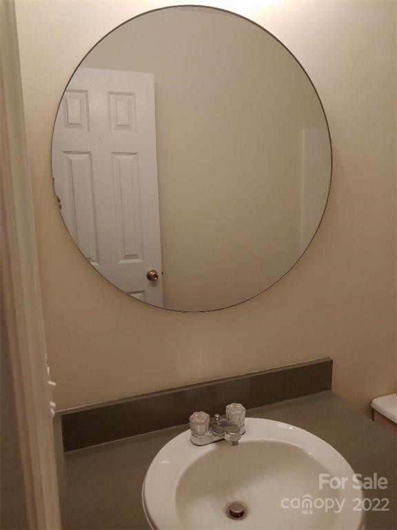 4016 Puetts Chapel Road Dallas, NC 28034 - Photo 16 of 22 a bathroom with a sink and mirror