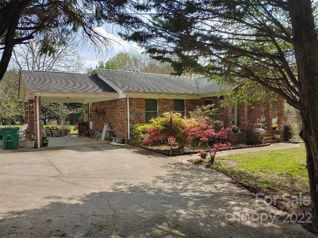 4016 Puetts Chapel Road Dallas, NC 28034 - Photo 2 of 22 a view of a house with yard and a garden