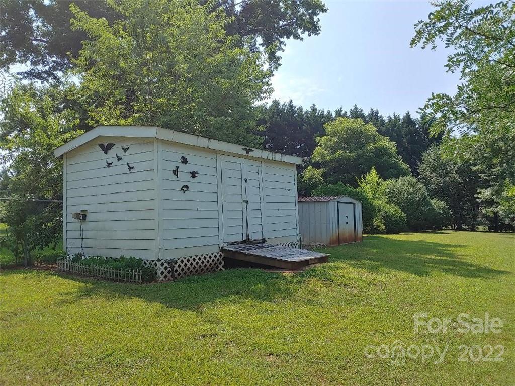 4016 Puetts Chapel Road Dallas, NC 28034 - Photo 21 of 22 a front view of a house with a yard