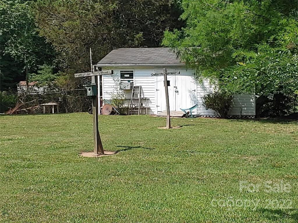 4016 Puetts Chapel Road Dallas, NC 28034 - Photo 22 of 22 a house that has a garden in front of it