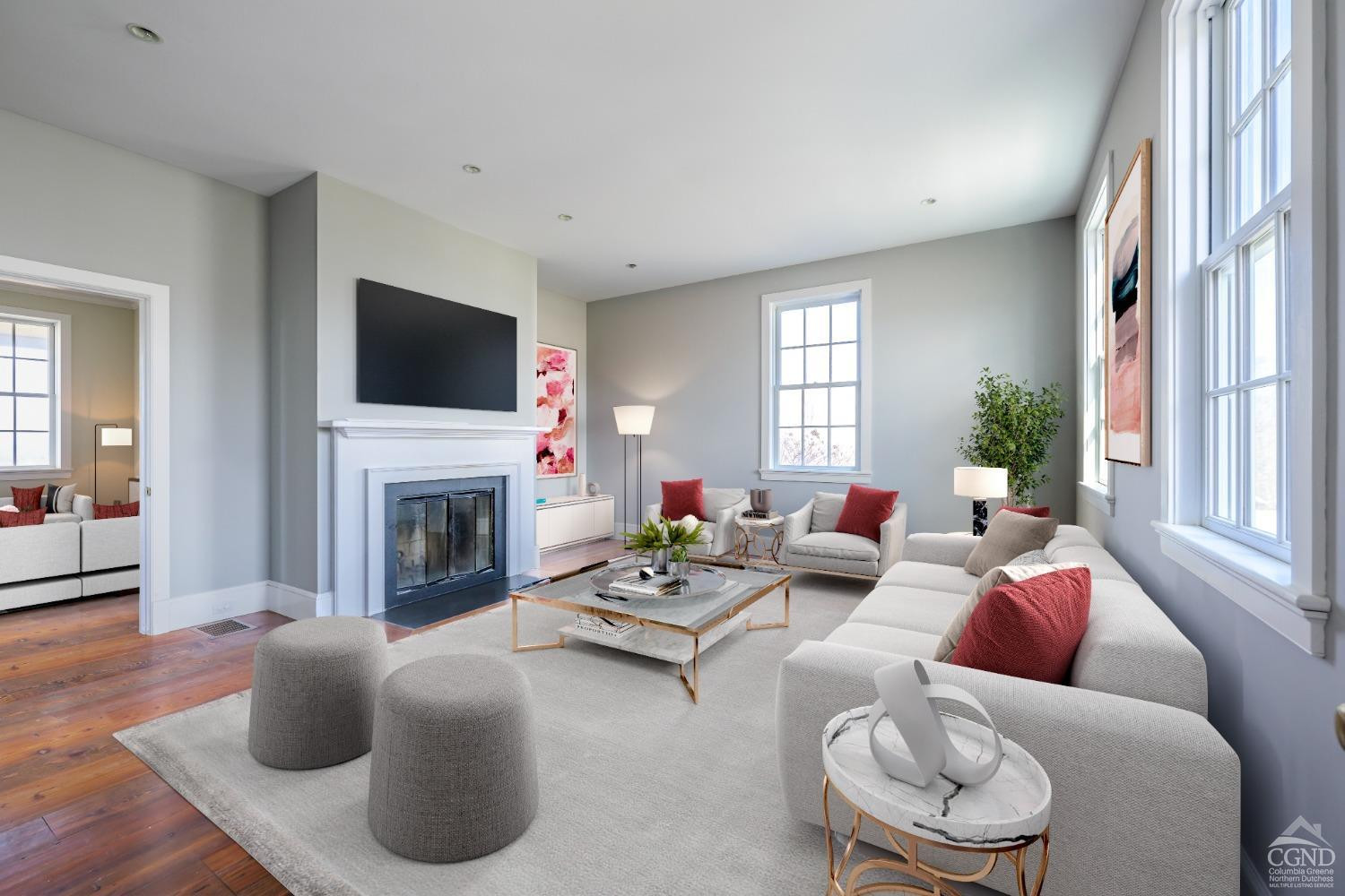 38 Miller Farm Road Claverack, NY 12413 - Photo 15 of 37 a living room with furniture a fireplace and a flat screen tv