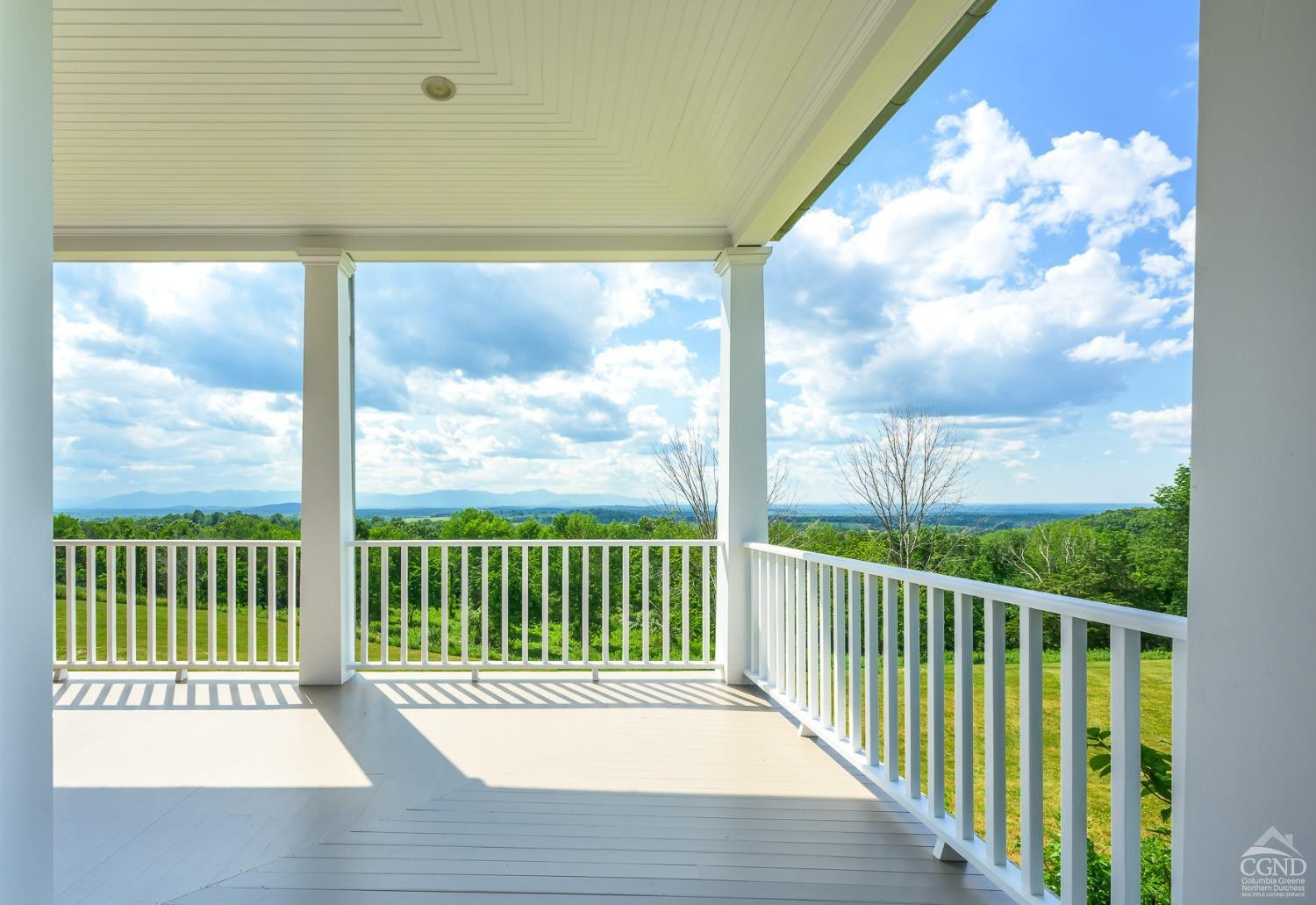 38 Miller Farm Road Claverack, NY 12413 - Photo 6 of 37 a view of a wooden deck next to a yard