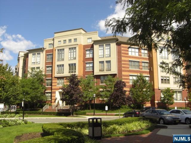 a front view of a building with garden