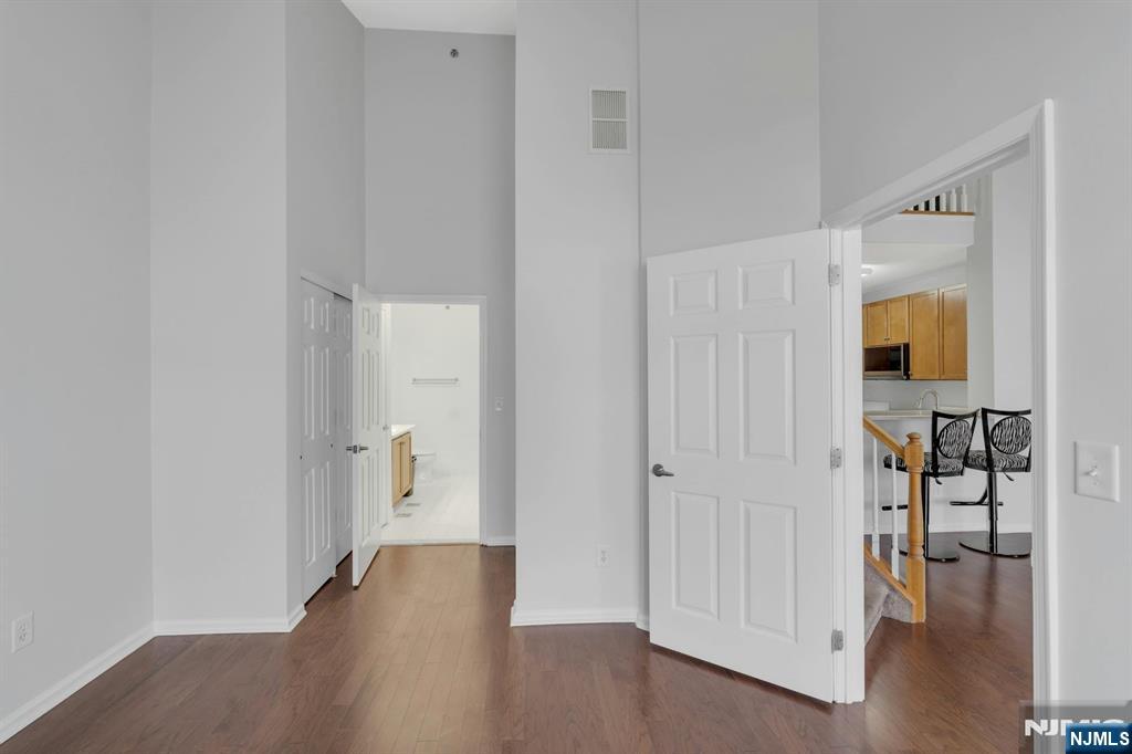 24 Ave At Port Imperial, Unit 401 West New York, NJ 07093 - Photo 11 of 27 a view of a hallway with wooden floor and a bathroom