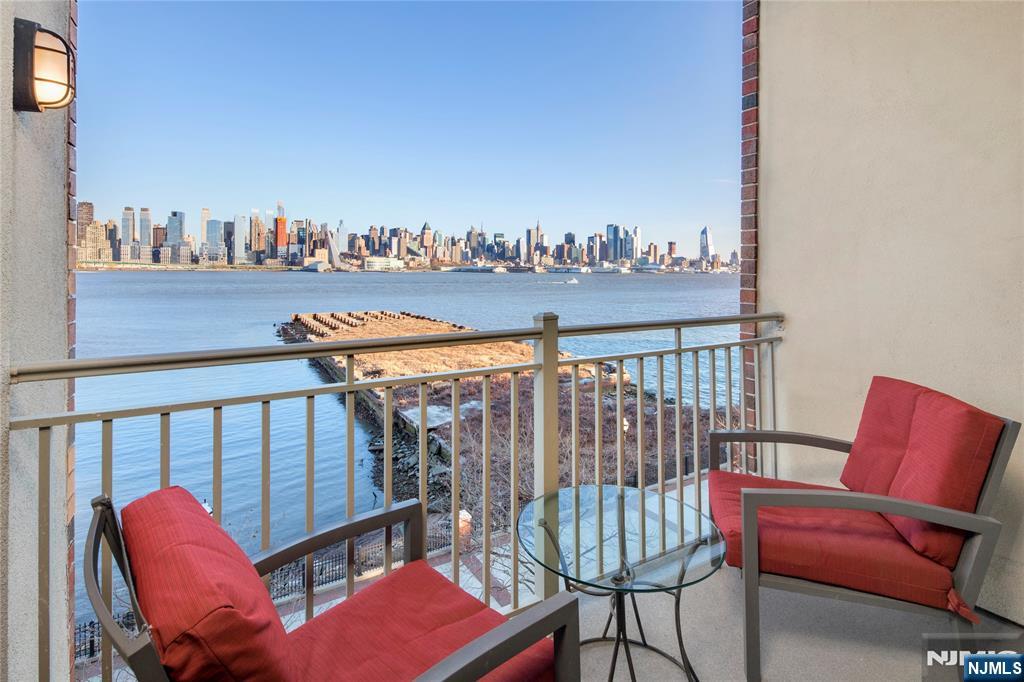 24 Ave At Port Imperial, Unit 401 West New York, NJ 07093 - Photo 20 of 27 a view of a chairs in balcony