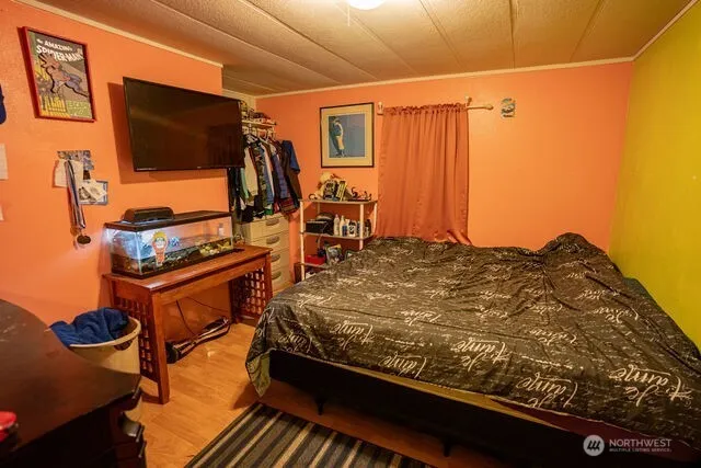 a bed room with a bed and a walk in closet