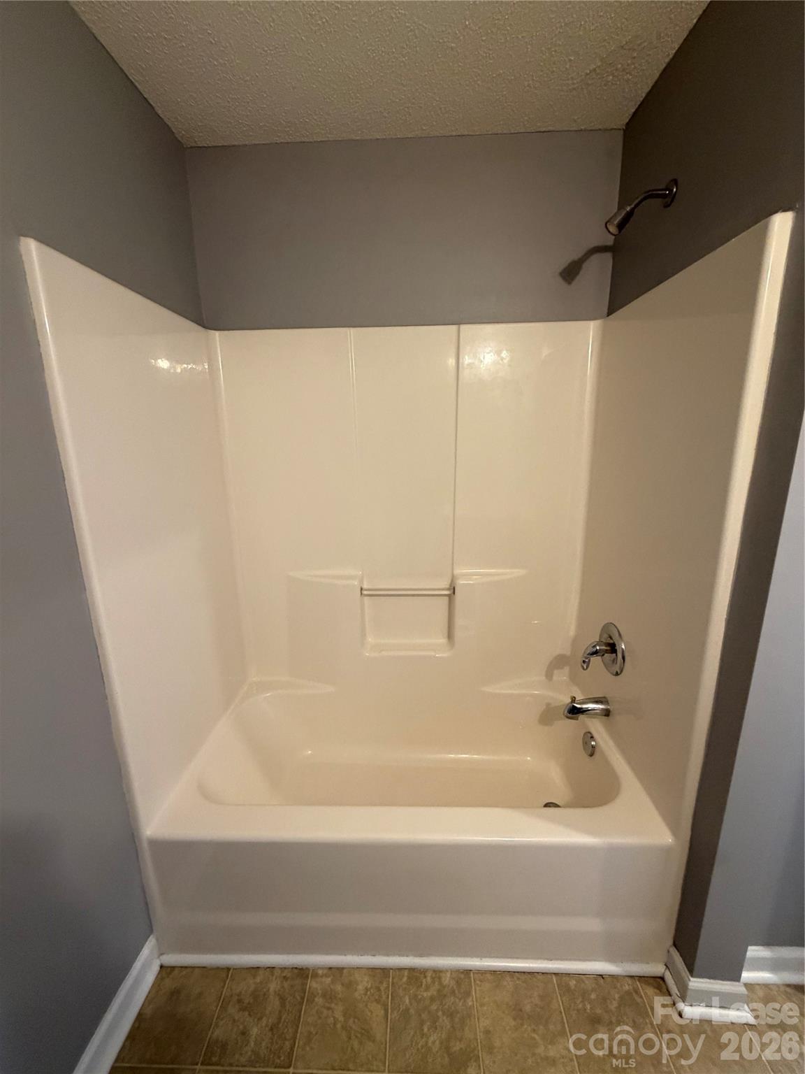 110 Steam Engine Drive, Unit 202 Mooresville, NC 28115 - Photo 17 of 26 a bathroom with a bathtub