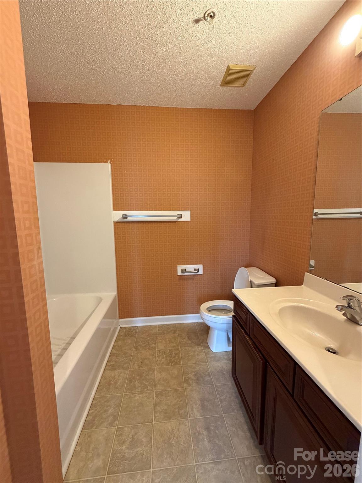 110 Steam Engine Drive, Unit 202 Mooresville, NC 28115 - Photo 20 of 26 a bathroom with a sink a toilet and bathtub
