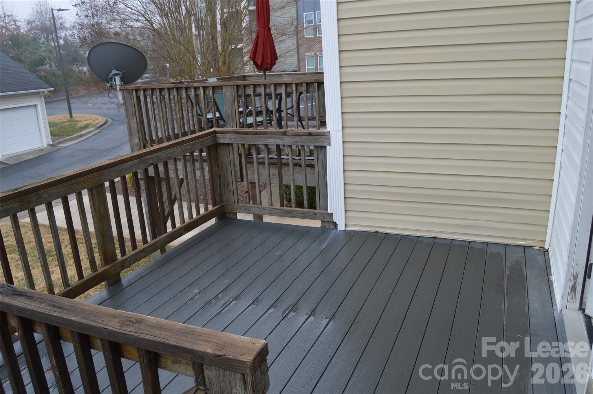 110 Steam Engine Drive, Unit 202 Mooresville, NC 28115 - Photo 10 of 26 a view of balcony with wooden floor