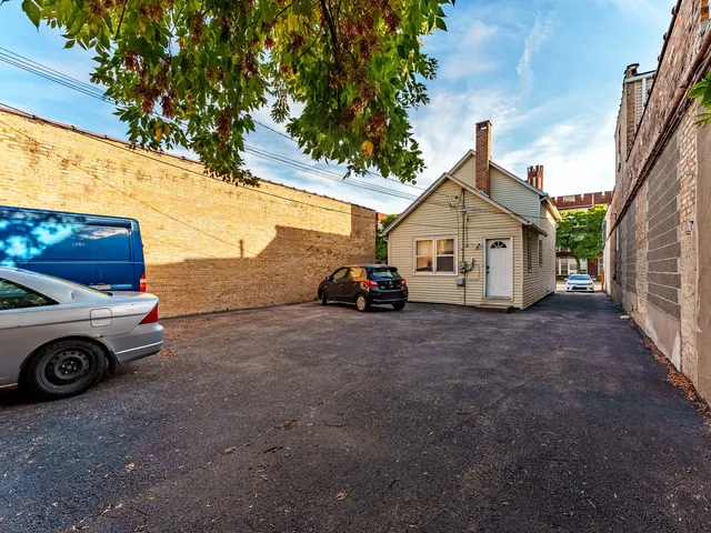a view of a car in front of a house