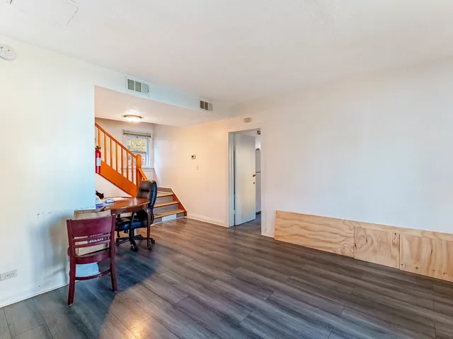 a view of a livingroom with furniture and wooden floor