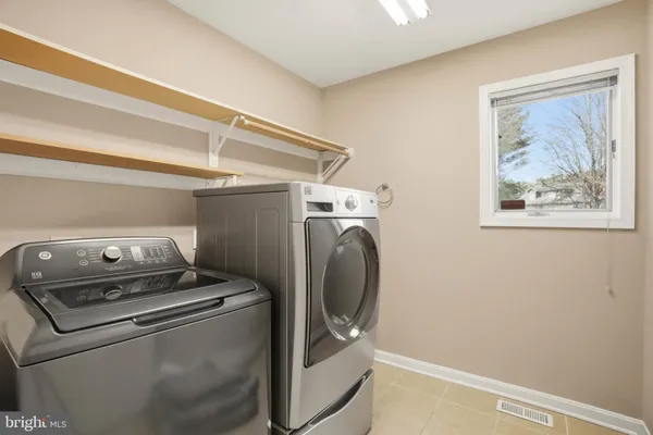 a bathroom with a granite countertop sink mirror and