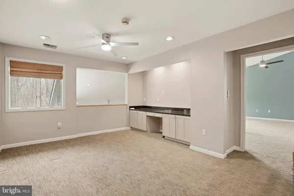 a view of an empty room with a window