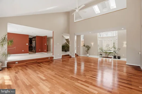 a living room with furniture window and wooden floor