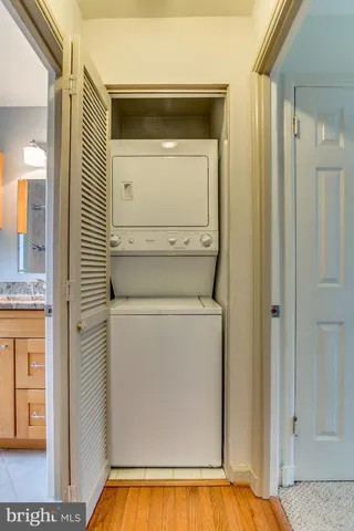 a view of bathroom with a sink and mirror