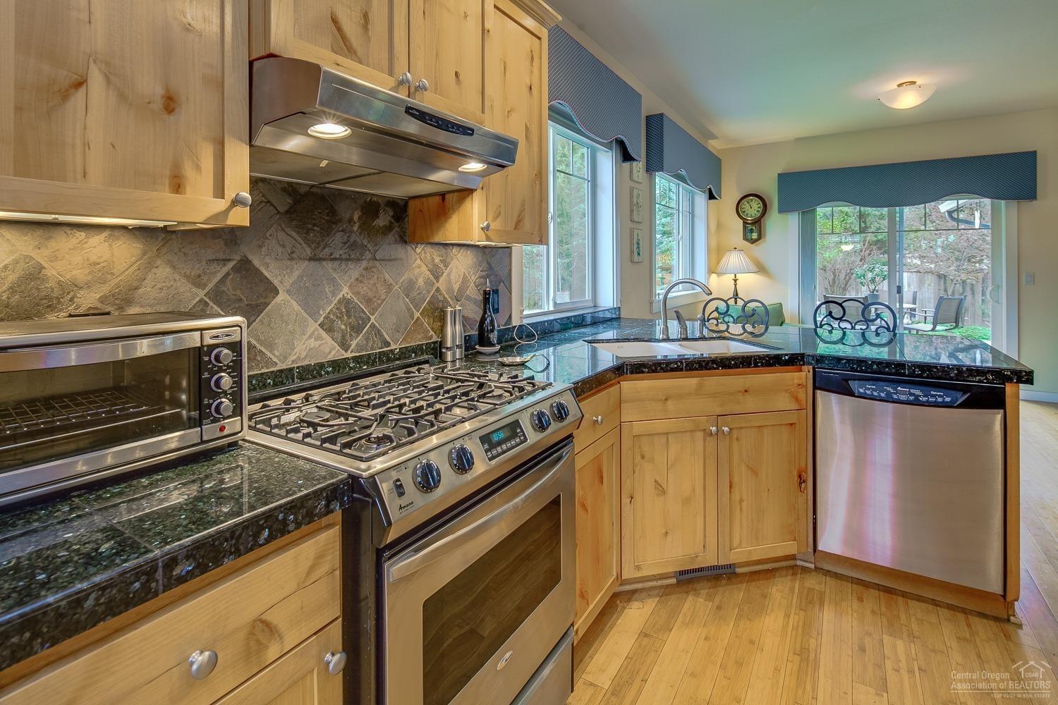 61209 Ridgewater Loop Bend, OR 97702 - Photo 10 of 25 Roomy kitchen features granite tile coun