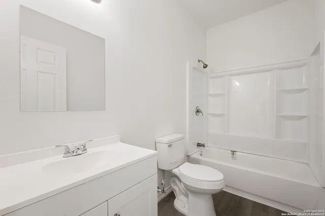 a bathroom with a sink a toilet and a bathtub