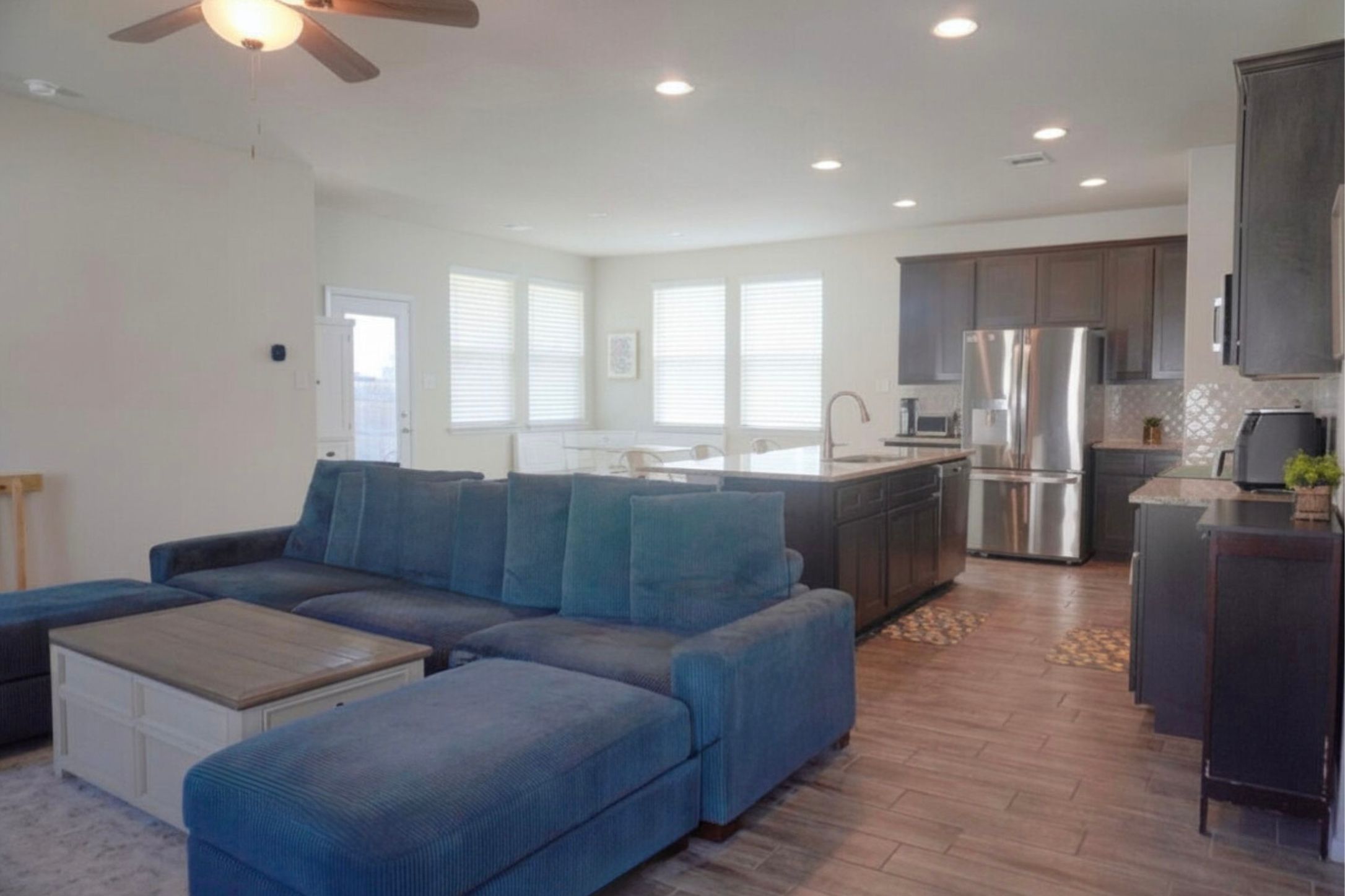 153 Blue Agate Court Jarrell, TX 76537 - Photo 6 of 20 a living room with stainless steel appliances granite countertop furniture and a kitchen view
