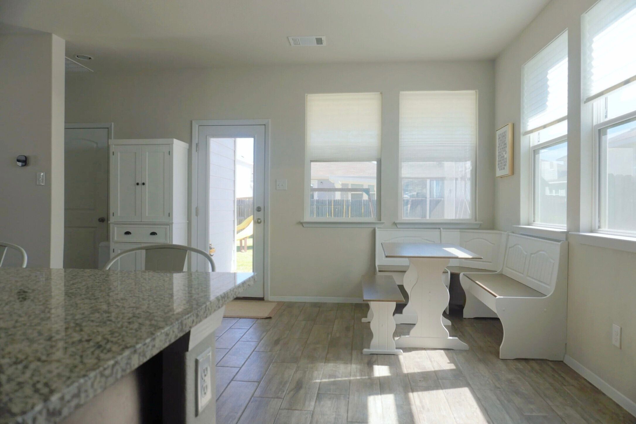 153 Blue Agate Court Jarrell, TX 76537 - Photo 8 of 20 a bathroom with a granite countertop sink and a large mirror