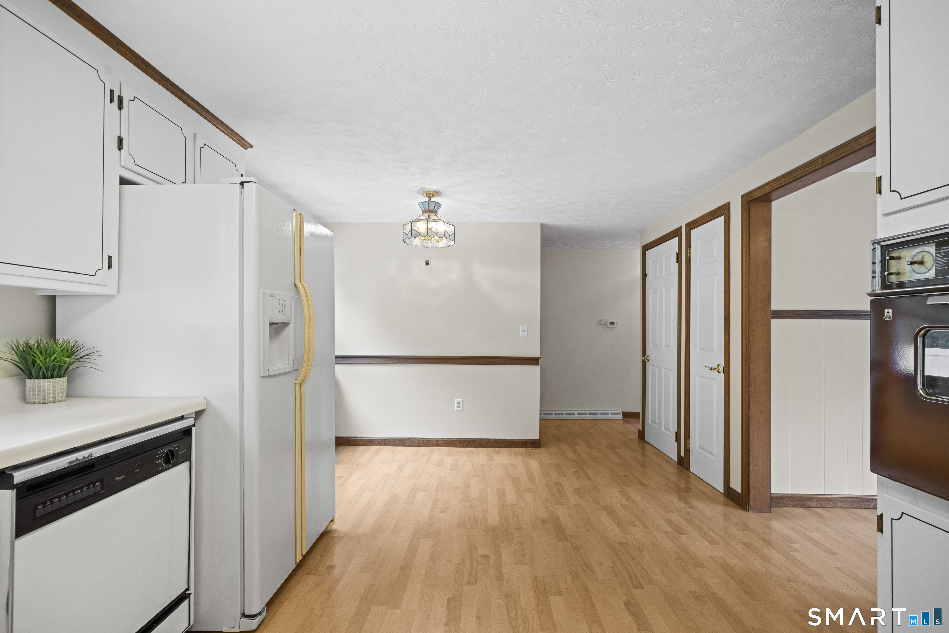6 Cartier Road Enfield, CT 06082 - Photo 12 of 40 a view of empty room with wooden floor and electronic appliances