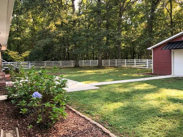 a backyard of a house with lots of green space