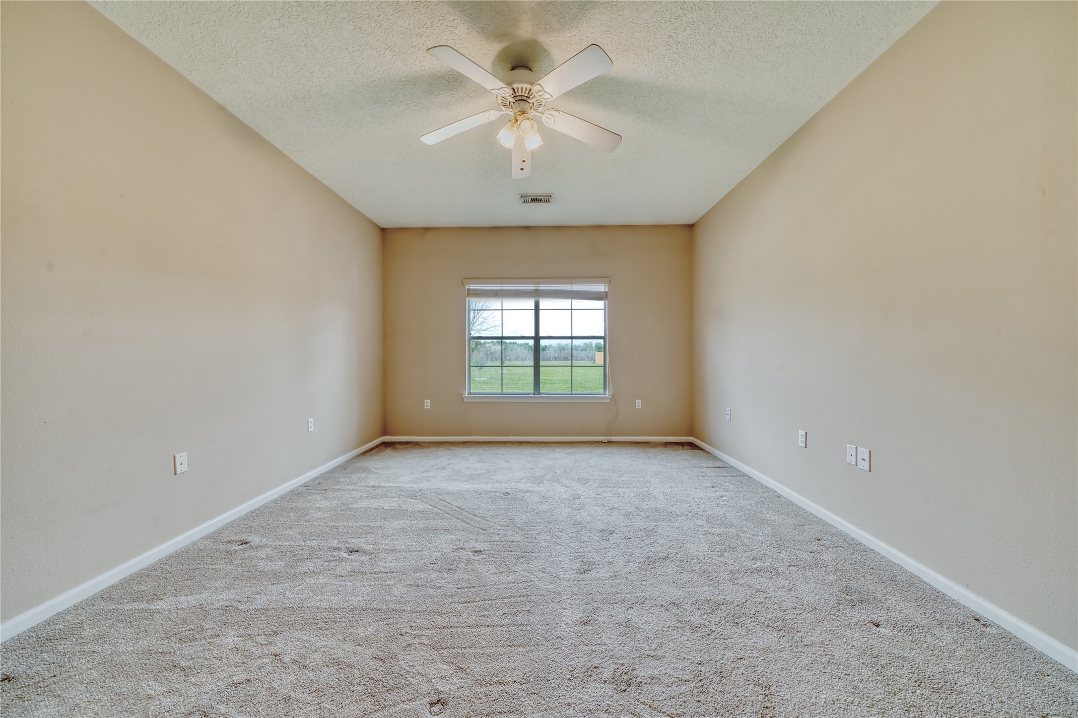 770 Hunt Road, Unit 314 Baytown, TX 77521 - Photo 18 of 26 an empty room with windows and fan