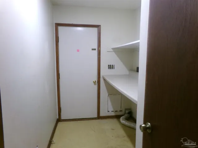 a view of a room with racks on the wall