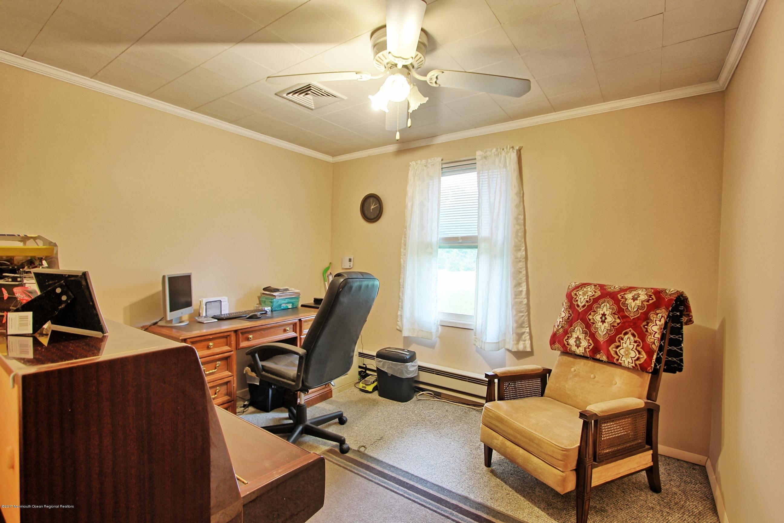 49 Siloam Road Freehold, NJ 07728 - Photo 17 of 38 a living room with furniture and a window