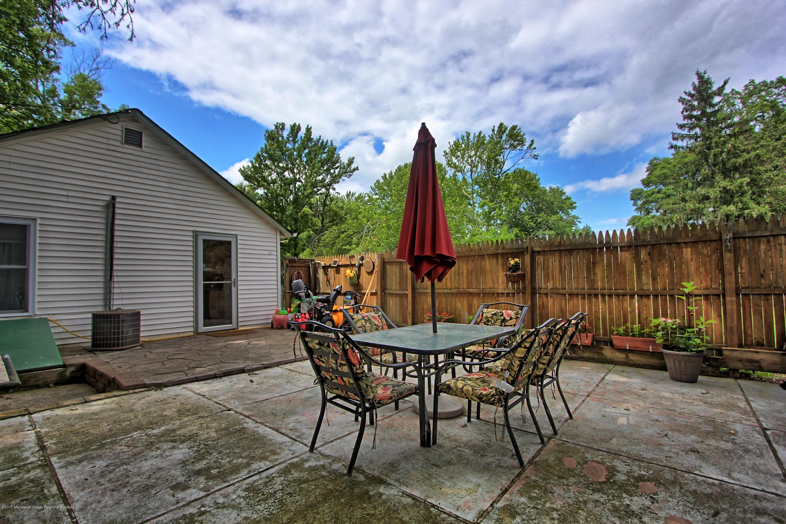49 Siloam Road Freehold, NJ 07728 - Photo 23 of 38 a view of a chairs and table in patio