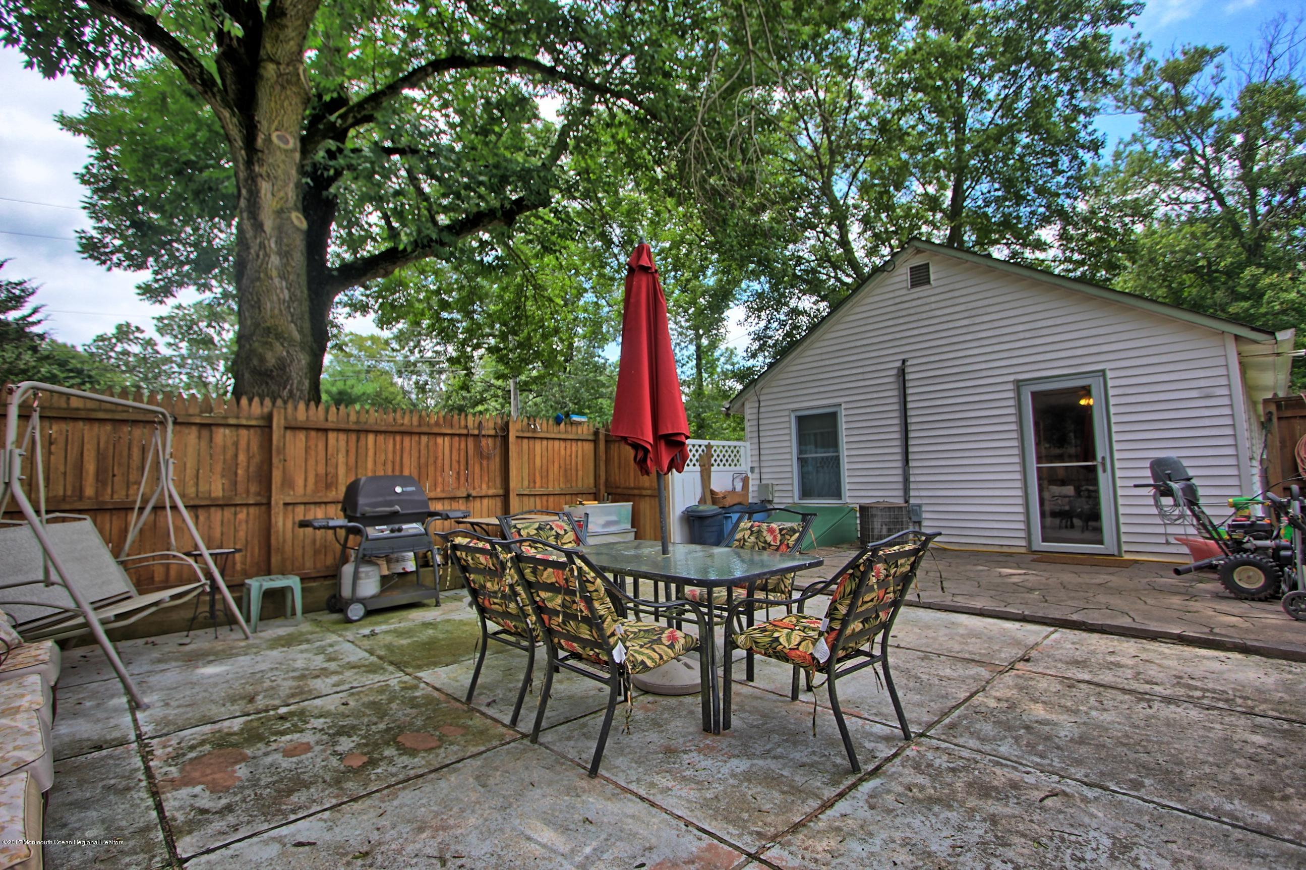 49 Siloam Road Freehold, NJ 07728 - Photo 24 of 38 a view of a chairs and table in patio