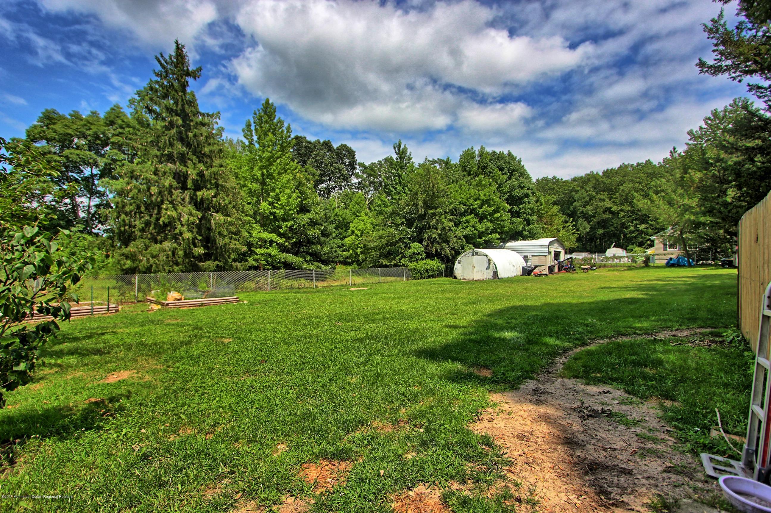 49 Siloam Road Freehold, NJ 07728 - Photo 34 of 38 a view of yard with grass & street