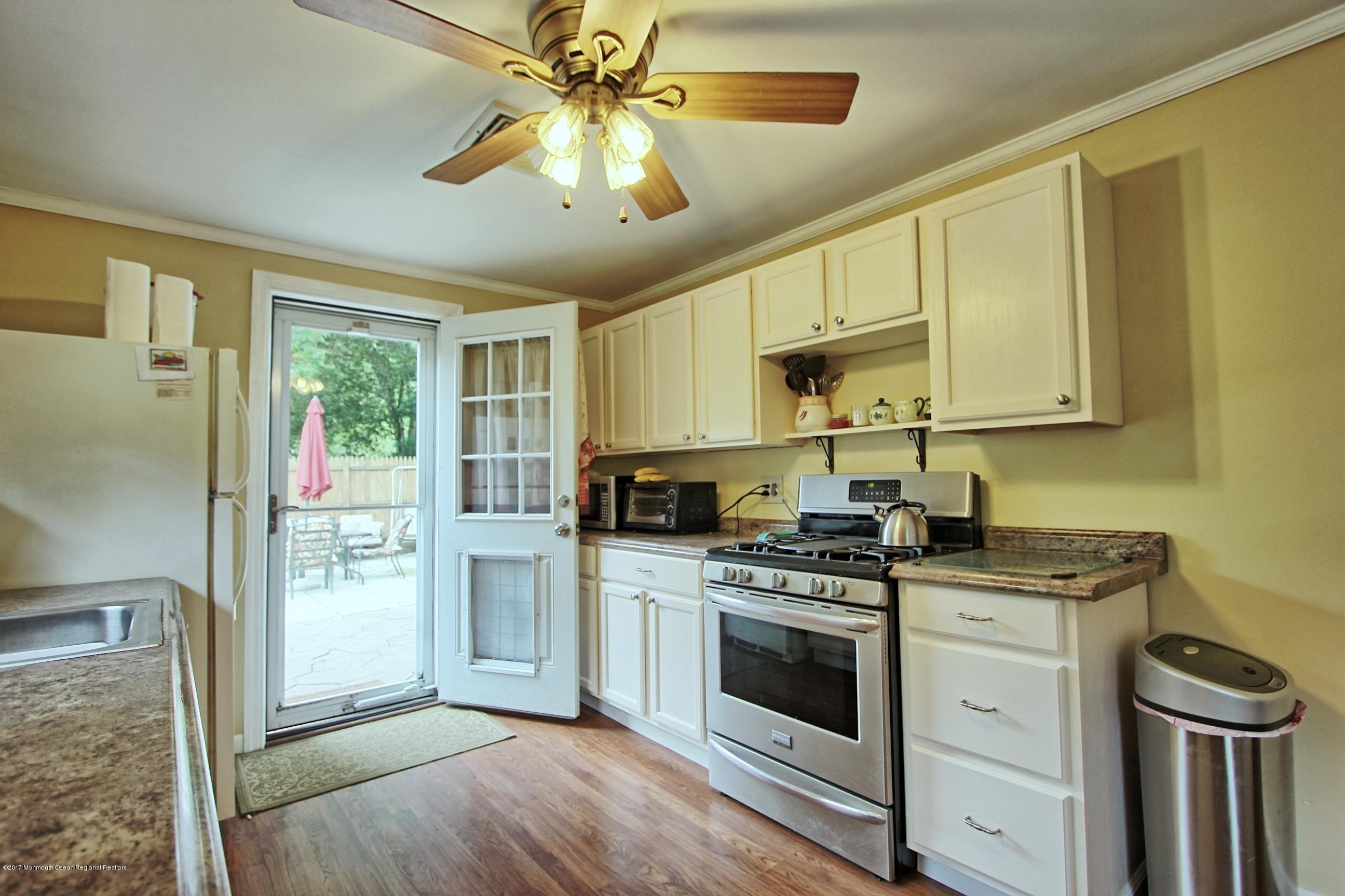 49 Siloam Road Freehold, NJ 07728 - Photo 4 of 38 a kitchen with stainless steel appliances a stove a sink dishwasher a refrigerator and a stove