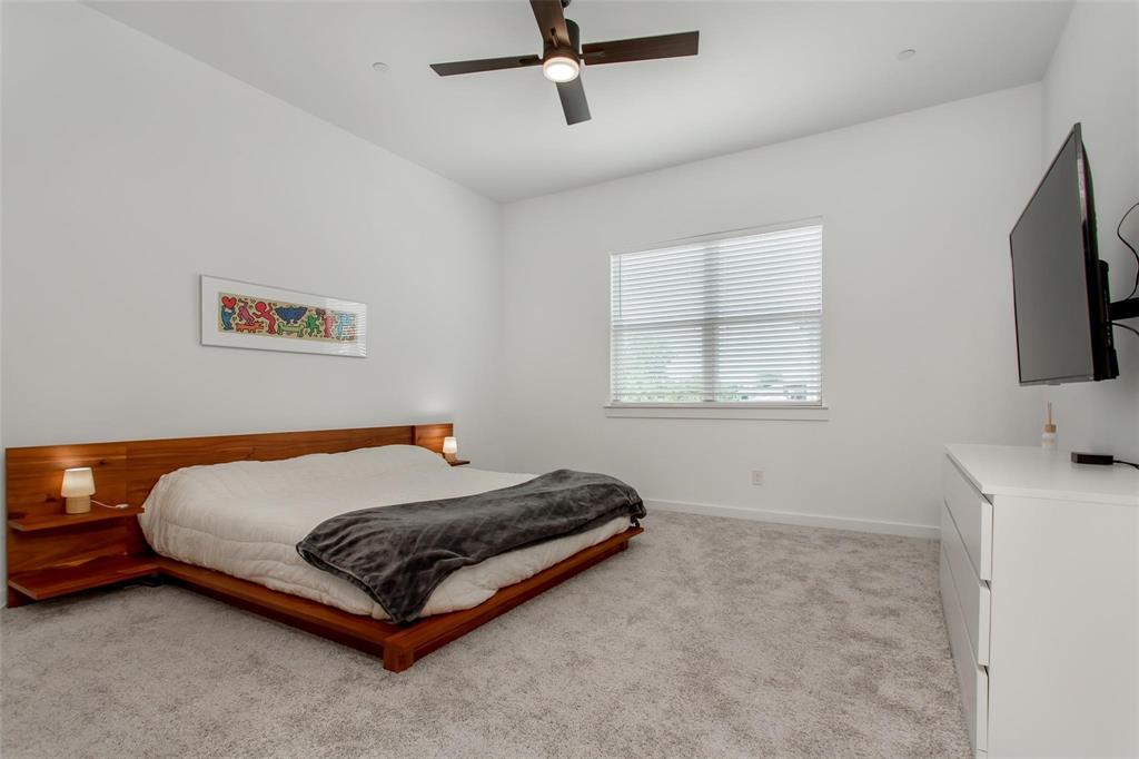 1737 Dalhart Road Plano, TX 75075 - Photo 20 of 28 a bedroom with a bed and a flat screen tv