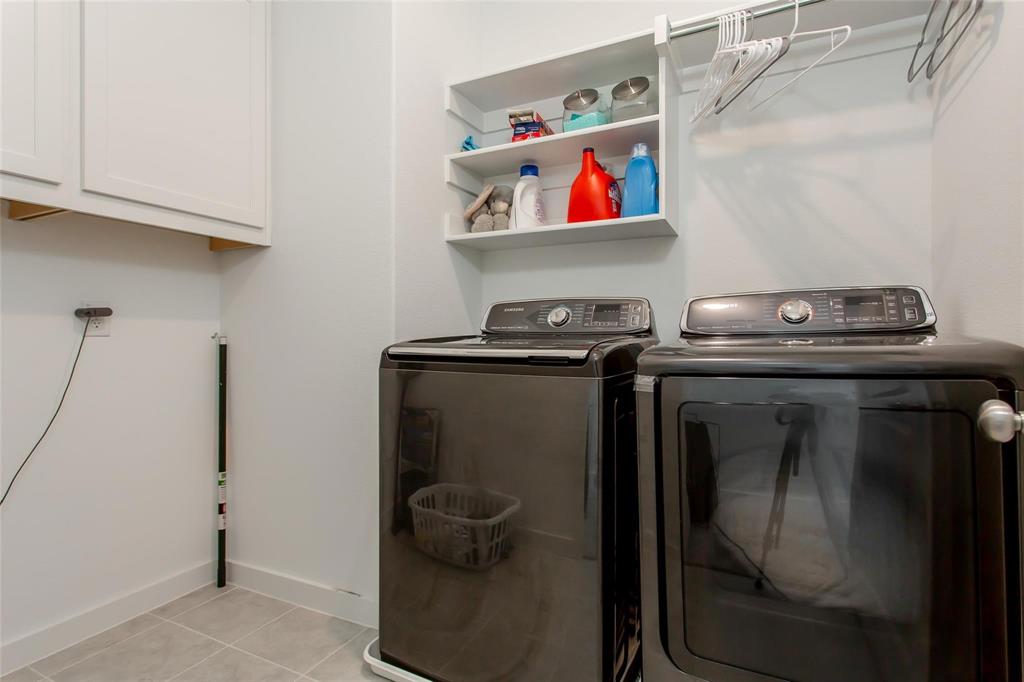 1737 Dalhart Road Plano, TX 75075 - Photo 26 of 28 a utility room with dryer and washer