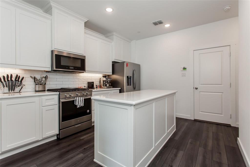 1737 Dalhart Road Plano, TX 75075 - Photo 10 of 28 a kitchen with a sink stove and microwave