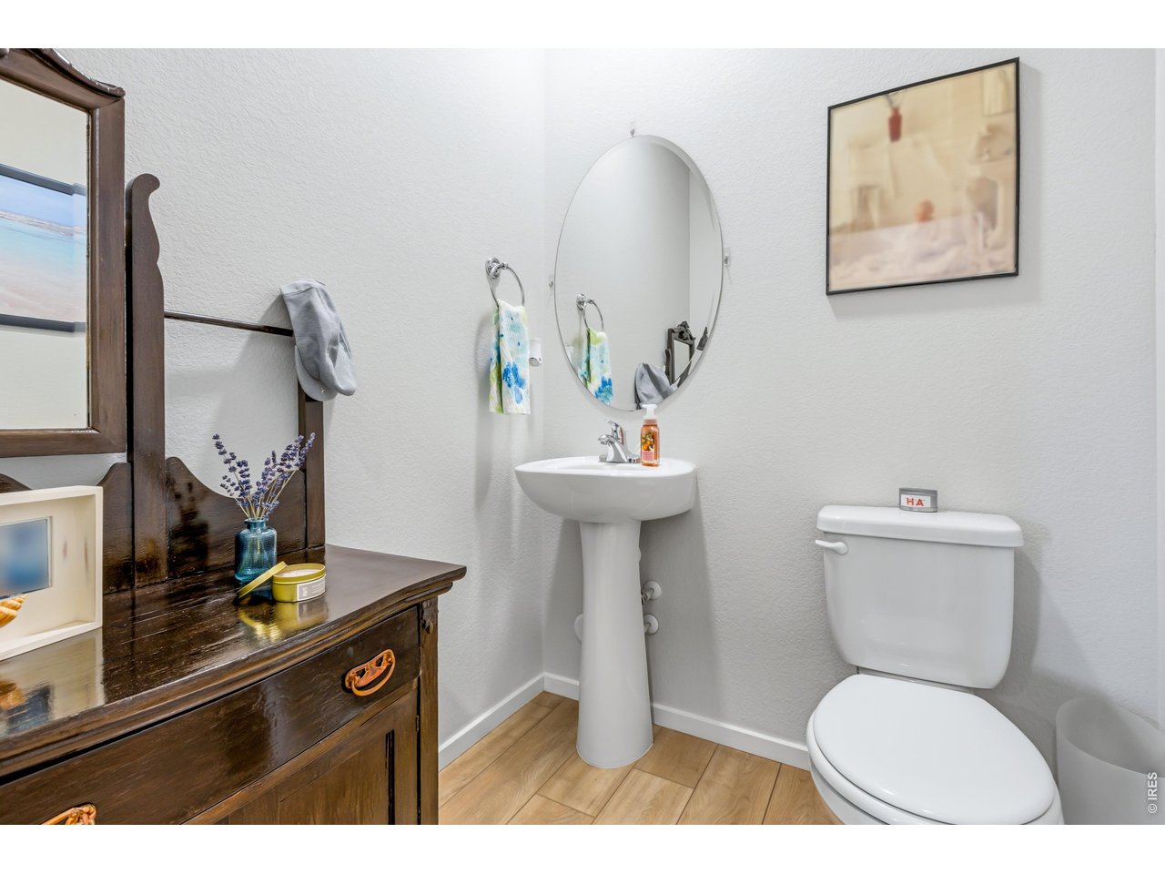 6609 4th St Road, Unit 4 Greeley, CO 80634 - Photo 19 of 41 a bathroom with a toilet a sink and mirror