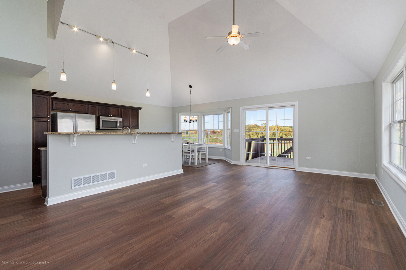 280 Sunset Boulevard Beecher, IL 60401 - Photo 12 of 48 an empty room with wooden floor and windows