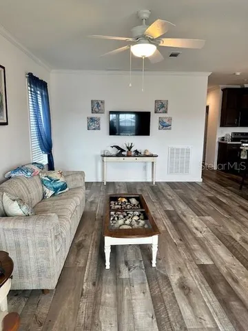 a kitchen with stainless steel appliances a refrigerator sink and stove