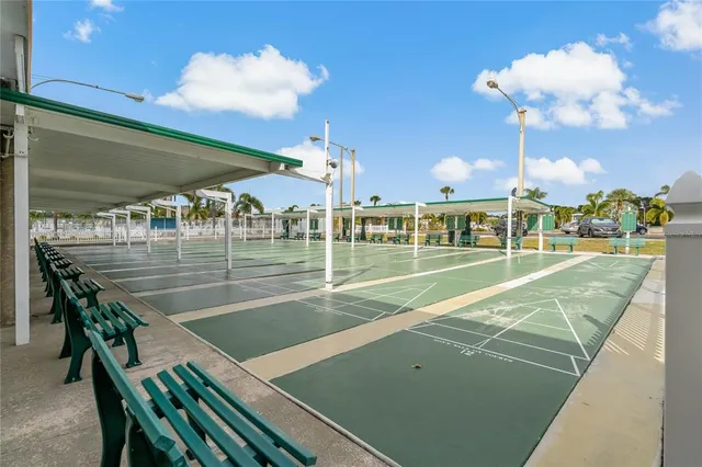 a view of a patio with table and chairs