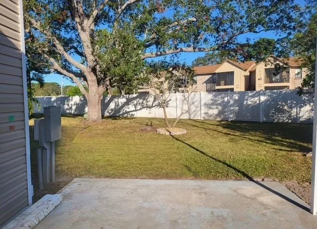 a view of a yard and front view of a house