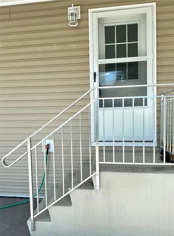 a view of a house with backyard and porch
