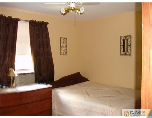 800 Farmingdale Road Jackson, NJ 08527 - Photo 17 of 22 a bedroom with a bed and a window