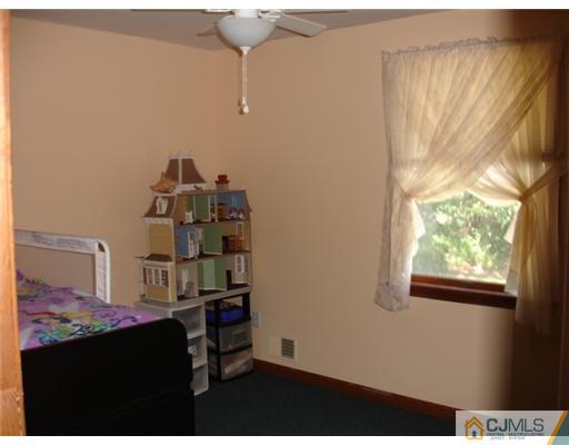 800 Farmingdale Road Jackson, NJ 08527 - Photo 21 of 22 a room with a wooden floor and a window
