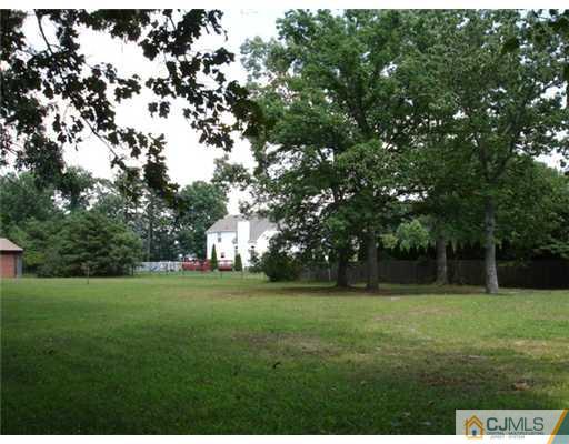 800 Farmingdale Road Jackson, NJ 08527 - Photo 22 of 22 a view of a green field with trees in the background
