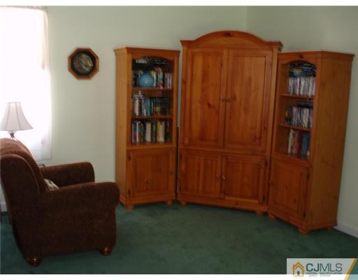800 Farmingdale Road Jackson, NJ 08527 - Photo 10 of 22 a livingroom with furniture and closet
