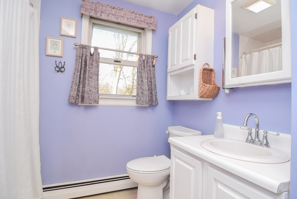 43 Russell Street Methuen, MA 01844 - Photo 19 of 37 a bathroom with a toilet sink and mirror