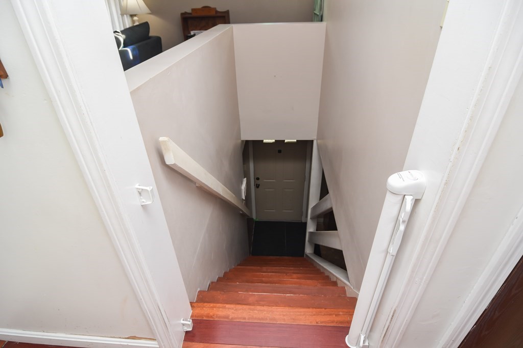 43 Russell Street Methuen, MA 01844 - Photo 20 of 37 a view of stairs and a bathroom with a sink
