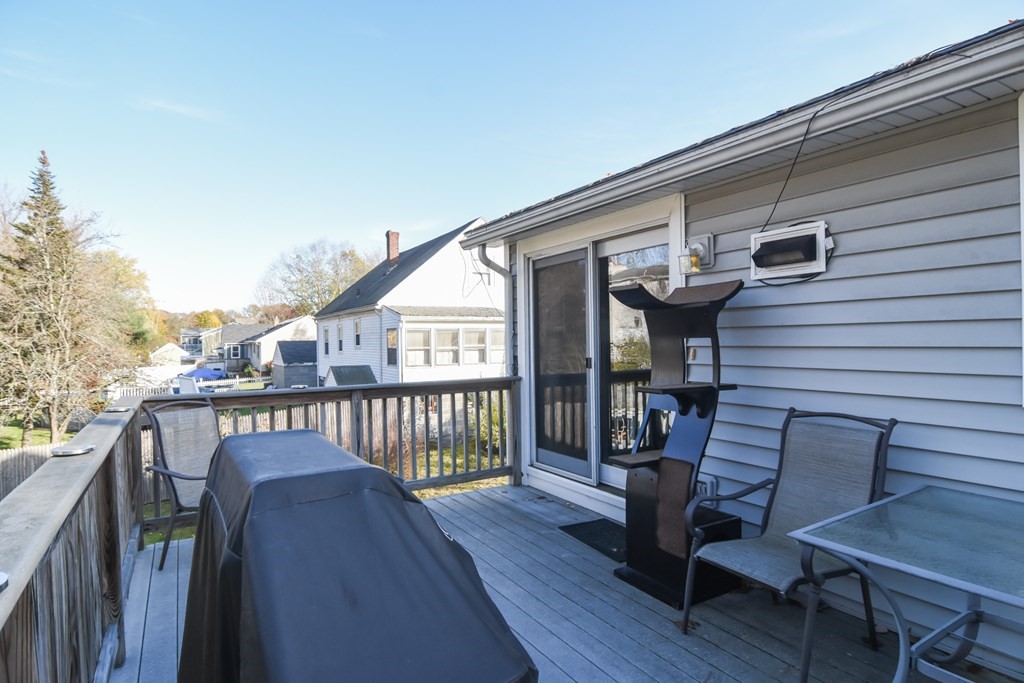 43 Russell Street Methuen, MA 01844 - Photo 27 of 37 a view of a chair and table in the balcony