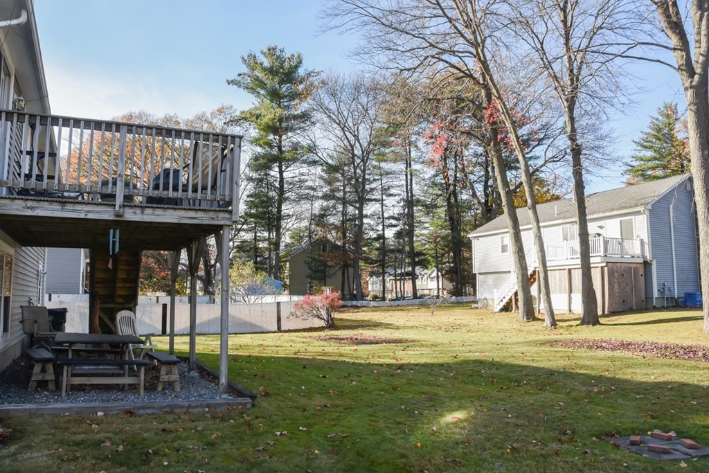 43 Russell Street Methuen, MA 01844 - Photo 6 of 37 a view of a swimming pool with a bench and trees