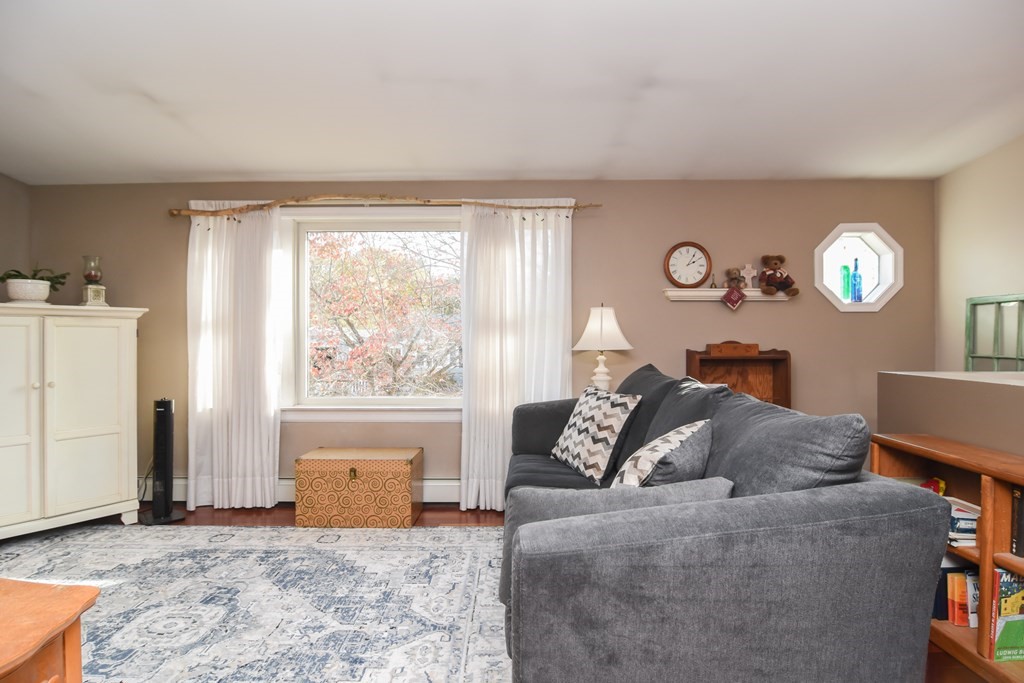 43 Russell Street Methuen, MA 01844 - Photo 9 of 37 a living room with furniture a bed and a window